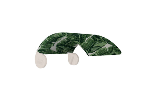 The Signature Chair Shade sunglasses by Ledge Lounger boast frames with green tropical leaf patterns and clear lenses, ideal for relaxing on your Signature Chair lounger. The temples also have matching leaf designs, set against a white background.