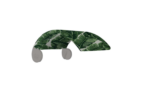 A decorative wall hook with a banana leaf pattern complements any Ledge Lounger Signature Chair Shade. Green leaves on a white background make it stylish, and it features two rounded ends for easy hanging.