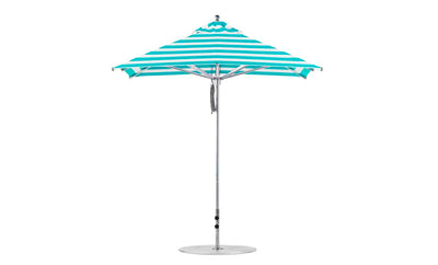 The Premier Aluminum Umbrella by Ledge Lounger features a turquoise and white striped design with marine-grade fabrics, set on a pointed aluminum pole and circular base. Its wind-resistant structure ensures stability when fully open, highlighting its symmetrical appeal.