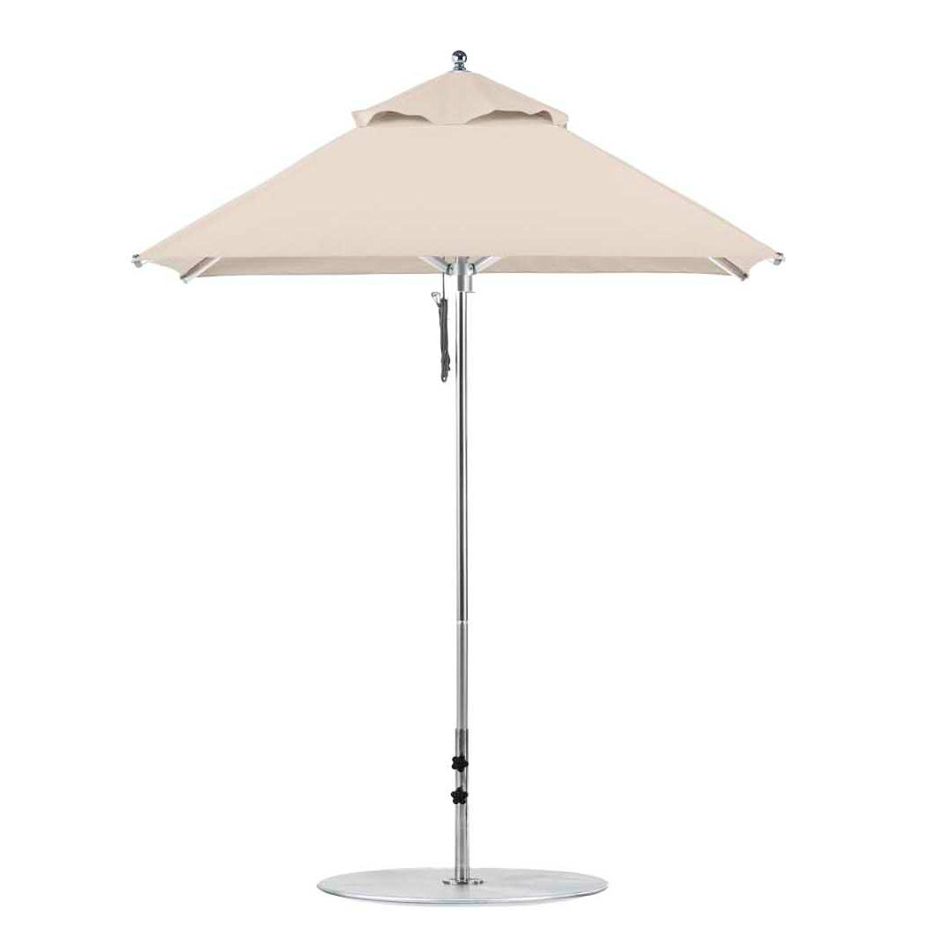 The Ledge Lounger Premier Aluminum Umbrella features a beige square canopy atop a silver pole with a circular base. Made from marine-grade fabrics, this umbrella includes a pulley system for easy adjustments and offers wind resistance for stability.