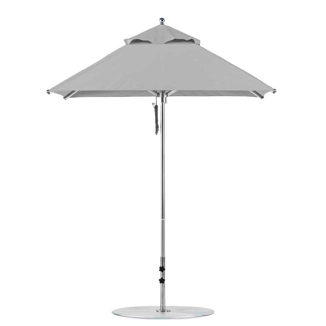 The Premier Aluminum Umbrella by Ledge Lounger is a 6.5 square, grey outdoor patio umbrella with a modern design. Crafted from marine-grade fabrics, it features a collapsible canopy and straight central pole for wind resistance, offering both durability and style.