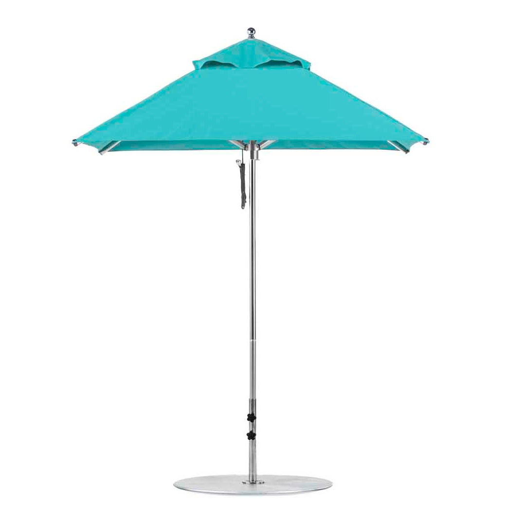 The Ledge Lounger Premier Aluminum Umbrella, featuring a sleek aluminum pole and round silver base, is crafted with marine-grade fabrics for a wind-resistant, durable design. This 6.5 square pulley umbrella has an open flat top, perfect for outdoor use.