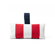 The Autograph Headrest Pillow by Ledge Lounger features red and white vertical stripes with a dark blue handle. Made from marine-grade fabric, its ideal for in-pool relaxation against a plain white background.
