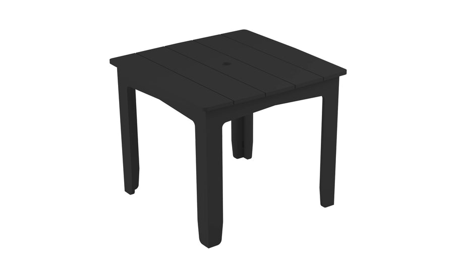 The Mainstay Square Dining Table by Ledge Lounger is a black square table with a simple slatted design featuring a central hole and built-in umbrella sleeve, ideal for outdoor dining. It has four sturdy legs and minimalist style, likely crafted from durable plastic.