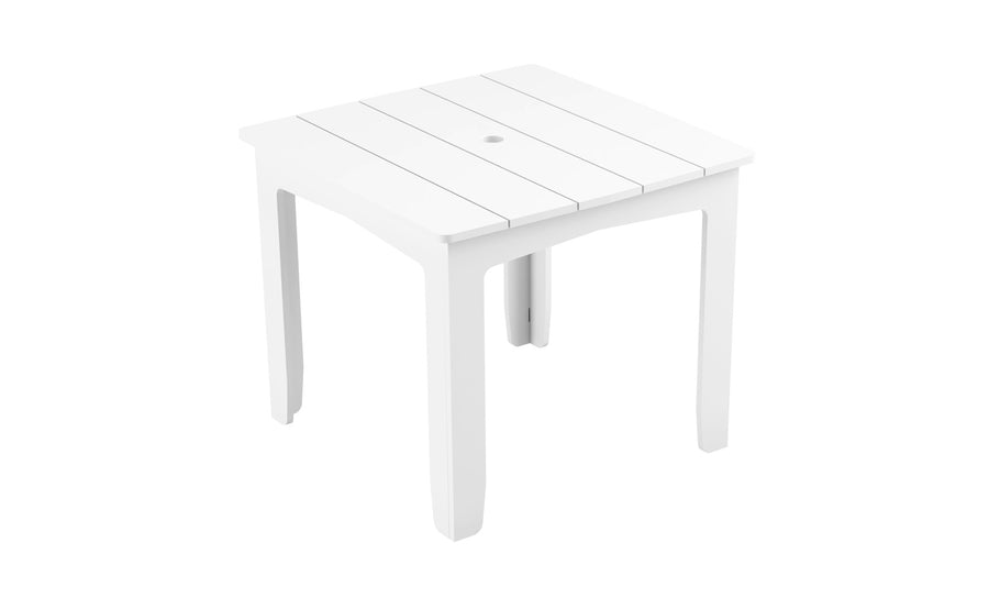 The Mainstay Square Dining Table by Ledge Lounger is white with a slatted top and four sturdy legs, ideal for outdoor dining. It includes a built-in umbrella sleeve in the center and is elegantly displayed against a plain white background.