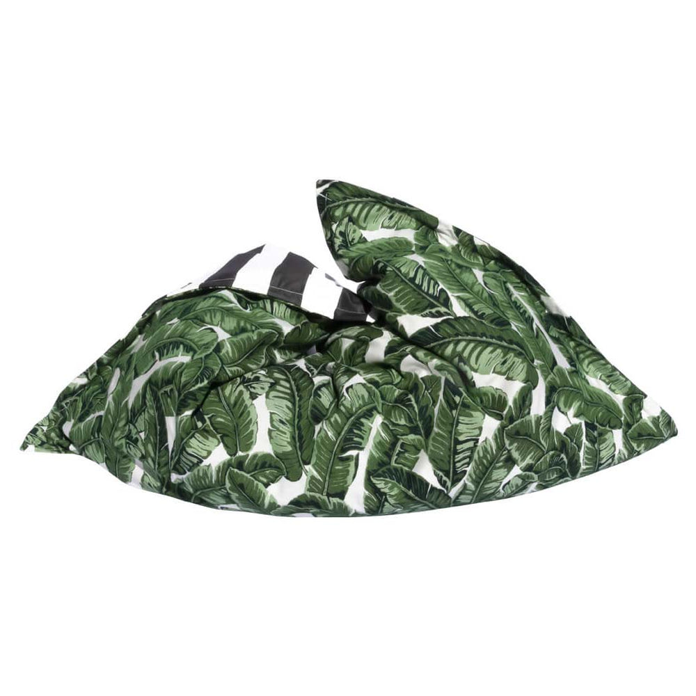 The Laze Pillow - Outer Bag ONLY (Retail) by Ledge Lounger features a relaxed, slouchy shape with a white background and green tropical leaf print. Final Sale.