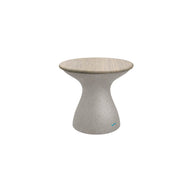 The Autograph Standard Side Table by Ledge Lounger features a modern hourglass design with a smooth light gray concrete finish and rounded top, ideal for contemporary interiors or as a chic outdoor side table by the pool.