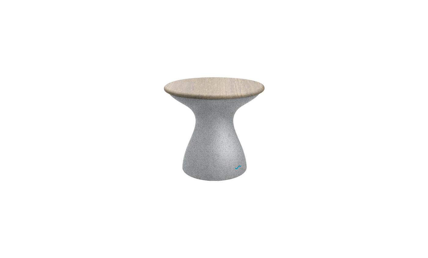 The Autograph Standard Side Table by Ledge Lounger is a small, modern stool with a sleek design. It features an hourglass-shaped gray base and a light wooden seat, perfect as an outdoor side table. Its minimalistic style complements any setting beautifully.