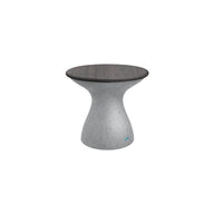 The Autograph Standard Side Table by Ledge Lounger features a sleek, hourglass design with a dark circular top and a gray textured base, all set against a white background.