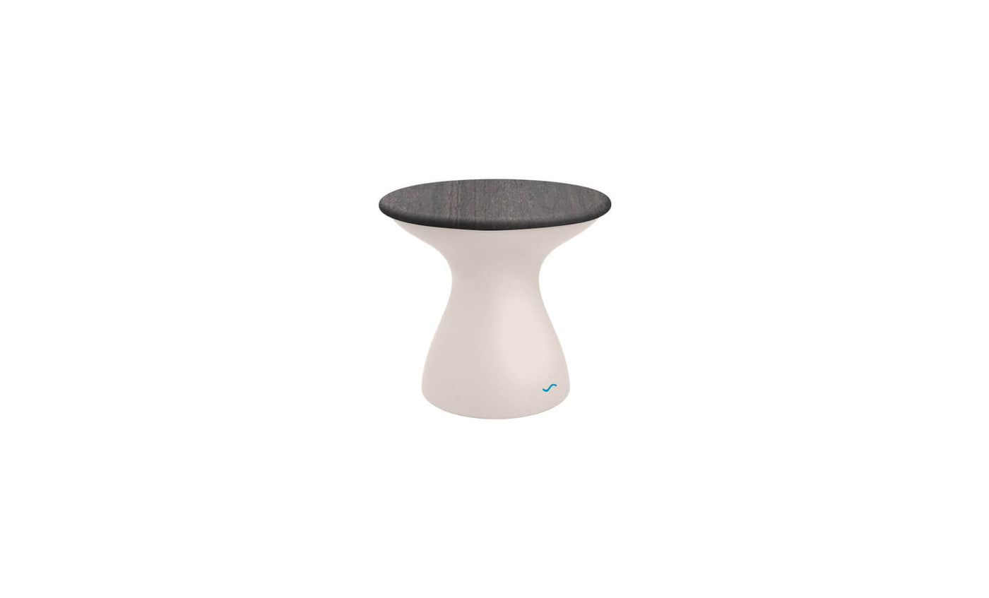 The Autograph Standard Side Table by Ledge Lounger is a modern outdoor side table with an hourglass shape, sleek gray top, and smooth white base. The base includes a subtle blue logo near the bottom, making it perfect for poolside storage or any stylish setting.