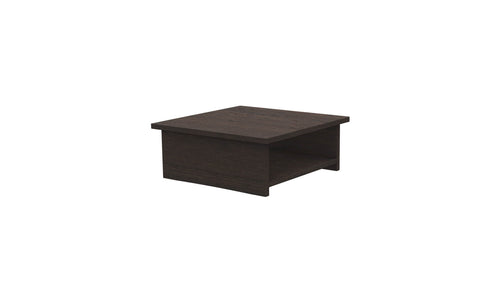 The Echo Side Table by Ledge Lounger showcases a dark brown, square silhouette with a smooth surface and subtle grain texture. Its minimalist design features a rectangular shelf beneath the tabletop, blending simplicity and functionality for patio essentials.