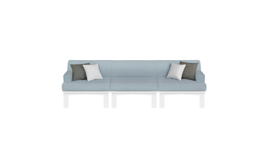 The Mainstay Sectional 3 Piece Sofa by Ledge Lounger is a long, light blue minimalist outdoor sectional set. It includes three sections and comes with two white and two gray throw pillows, styled for comfort against a plain white background.