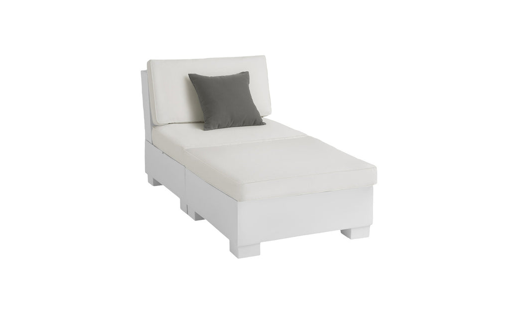 The Ledge Lounger Signature Sectional 2 Piece Sun Chair is a white outdoor chaise lounge made from durable materials. It features square cushions, a gray throw pillow on the backrest, and block legs, offering a clean, minimalist design to enhance your relaxation experience.