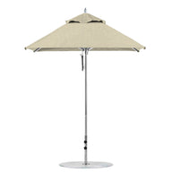 A Ledge Lounger Premier Aluminum Umbrella in beige features a round canopy with a silver pole on a circular base, available as a 6.5 square pulley model in the final sale.