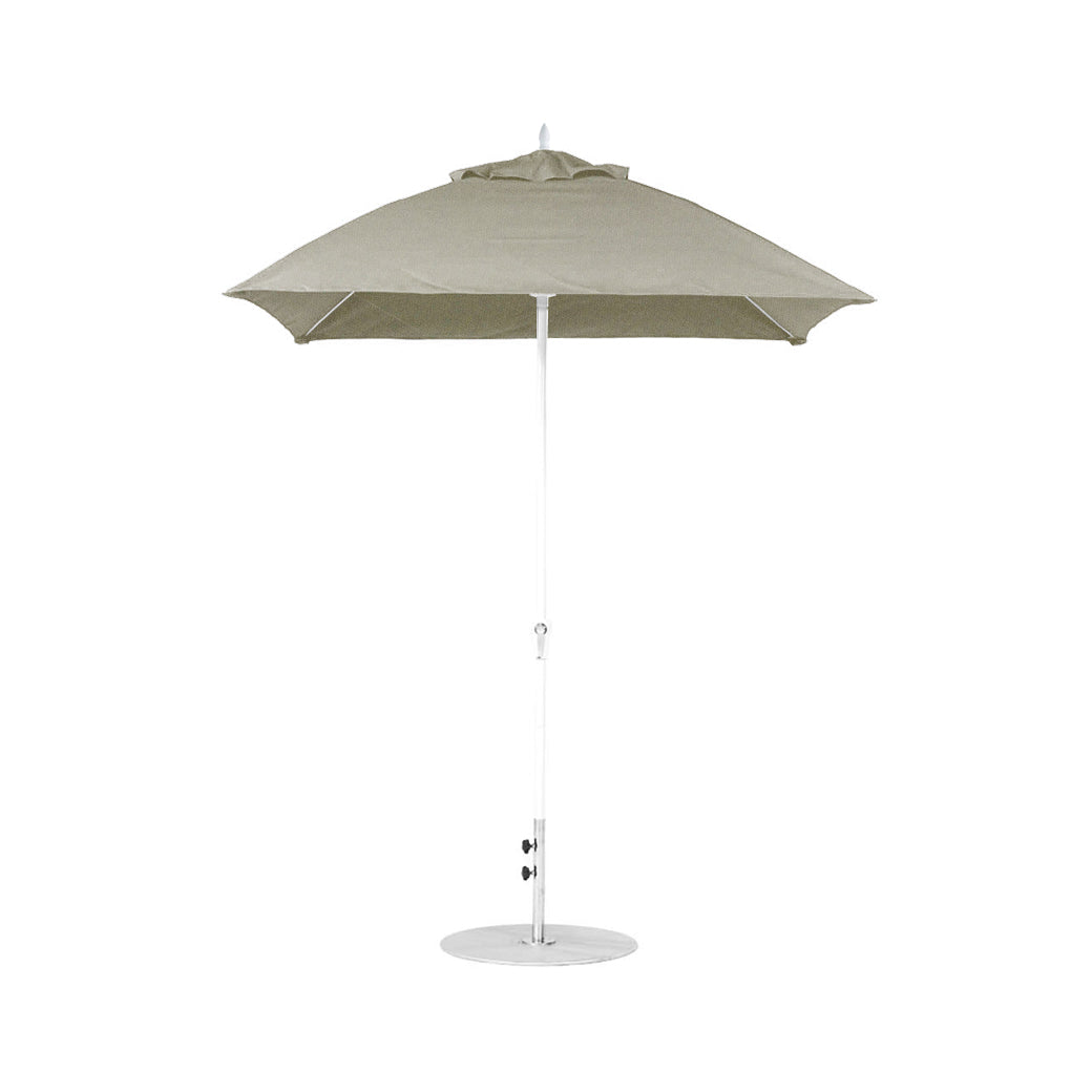 A beige square canopy Essential Fiberglass Umbrella - 7.5 Square Crank - Final Sale by Ledge Lounger, with a white pole on a circular base, is open and showcased against a plain white background.