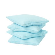 Four light blue square bean bags from Ledge Lounger's Bean Bags Set are stacked atop each other against a white background.