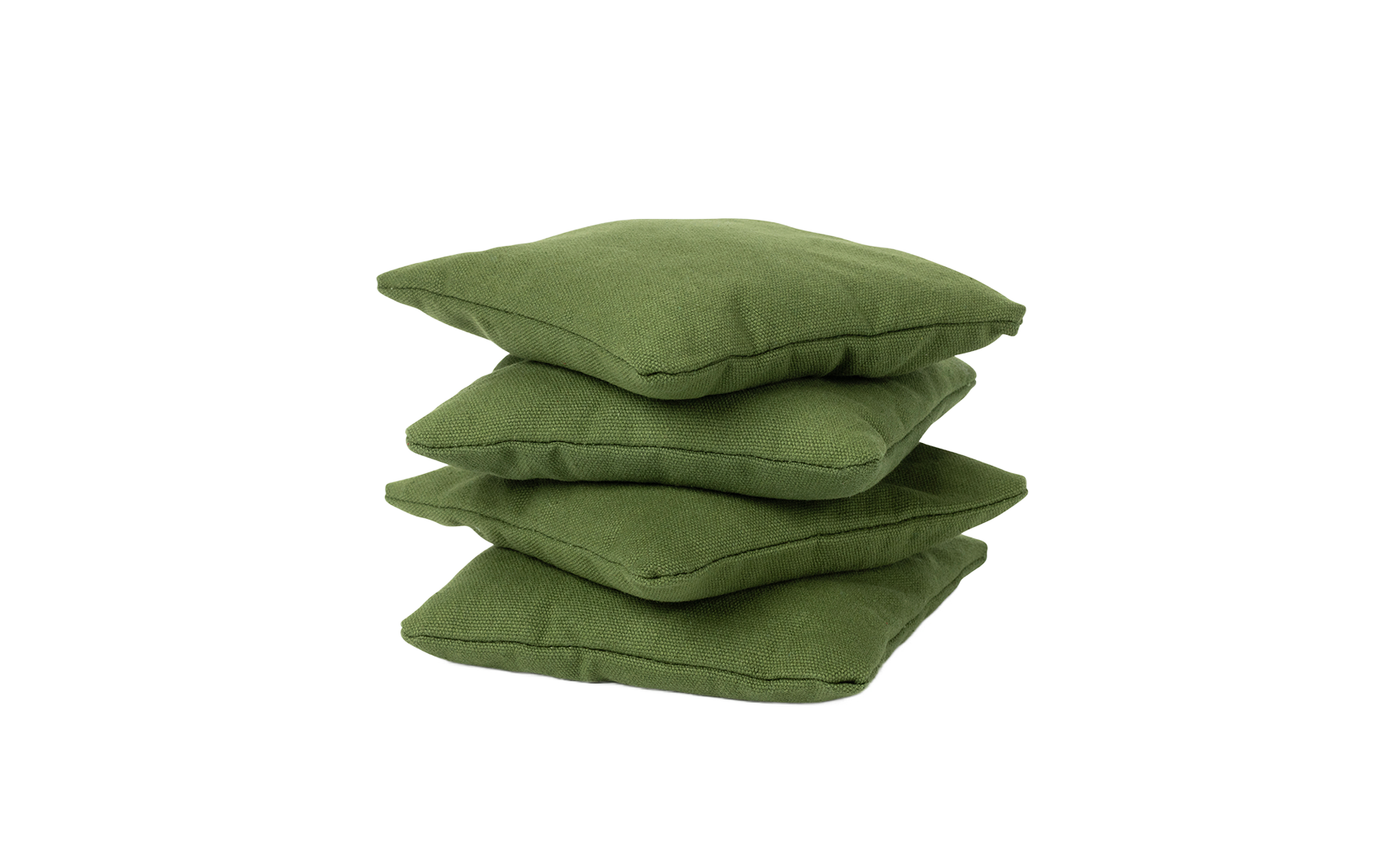The Bean Bags Set of Four by Ledge Lounger are stacked on a white background, perfect as outdoor seating for your next gathering.