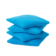 Four vibrant blue square bean bags from Ledge Lounger are stacked against a white background, resembling a colorful cornhole set.