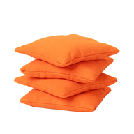 Four Ledge Lounger Bean Bags, set of four in bright orange, are stacked neatly on top of each other against a plain white background, showcasing their premium quality and durability.