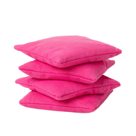 The Ledge Lounger Bean Bags Set of Four features square, bright pink bean bags neatly stacked against a white background, adding a playful touch to any space.