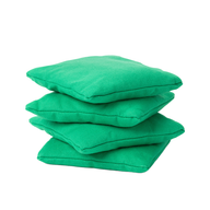Four green Ledge Lounger bean bags are stacked on a white background, perfect for enhancing your cornhole set.