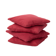 A stack of four Ledge Lounger Bean Bags Set of Four, in vibrant red, neatly arranged on top of each other against a white background—great for pairing with your outdoor bean bags or cornhole set.