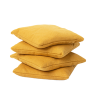 Four durable mustard yellow Ledge Lounger Bean Bags stacked together against a white background.