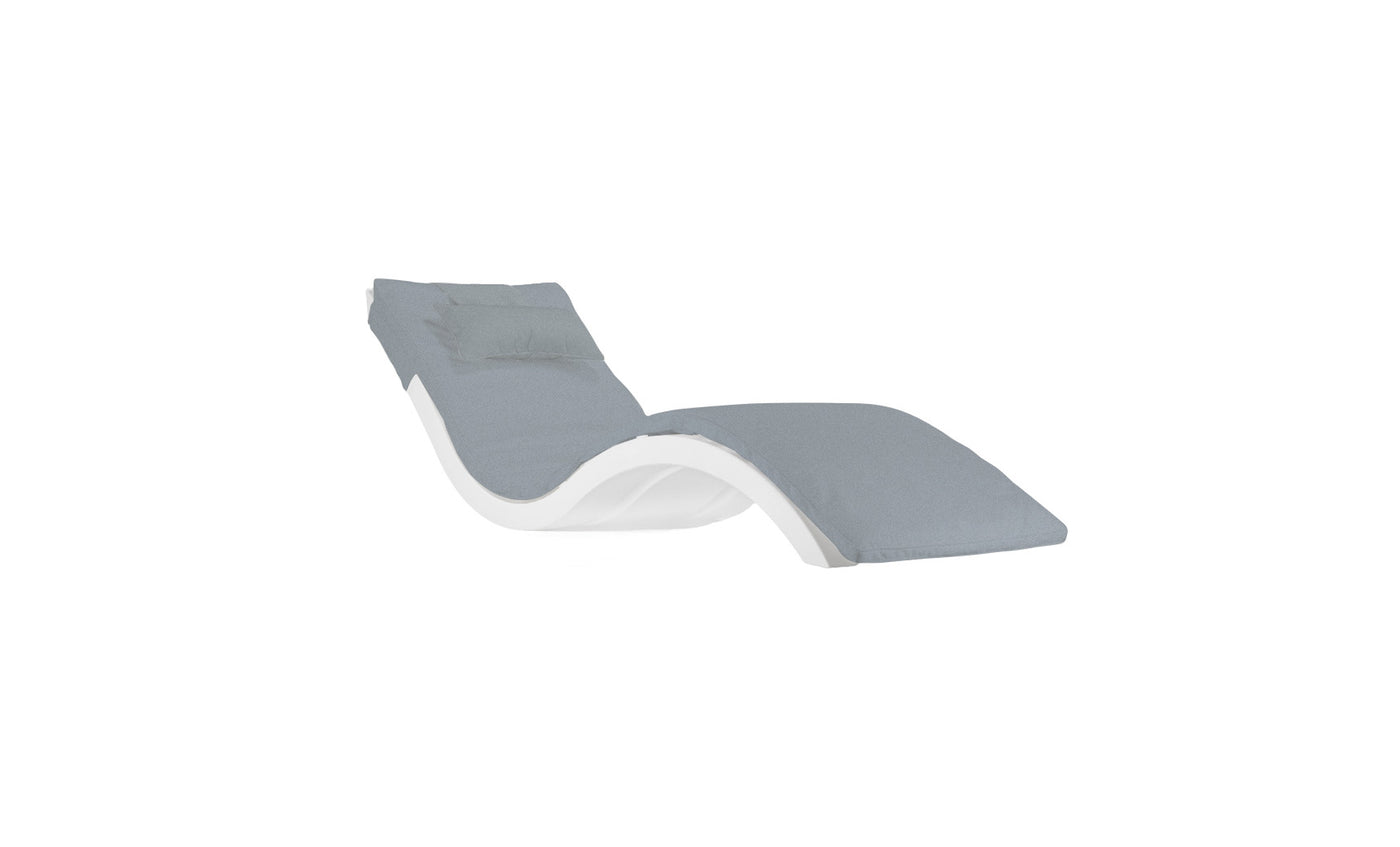 Meet the Signature Chaise Cushion by Ledge Lounger: a modern outdoor chaise lounge featuring an elegant curved white frame with a gray cushion. Its wave-like design offers ergonomic support and comfort, completed by an optional headrest pillow for ultimate relaxation.