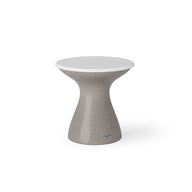 The Autograph Tall Ice Bin Side Table by Ledge Lounger is a modern, hourglass-shaped stool with a textured gray body and smooth white circular seat, ideal as an outdoor side table against a plain white background.