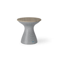 The Autograph Tall Ice Bin Side Table by Ledge Lounger features a modern design with a textured gray hourglass base and smooth wooden seat, which doubles as a chic outdoor stool.