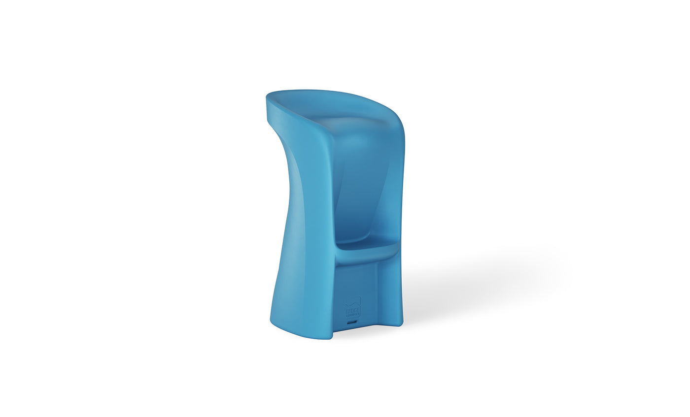 The Signature Barstool Bar Height by Ledge Lounger is a modern, blue plastic stool with a high curved backrest and footrest. Its sleek abstract design and smooth weatherproof surface make it ideal for outdoor entertaining, standing gracefully on a white background.