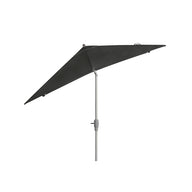The Ledge Lounger 8.5 Square Signature 360° Tilt Umbrella, with a sleek silver pole in a dark green triangular design, epitomizes resort-level elegance as it stands against a white background.