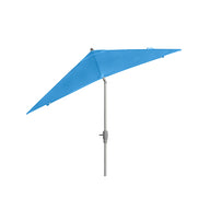 The Ledge Lounger 8.5 Square Signature 360° Tilt Umbrella, a large blue patio accessory with a metal pole crafted from premium materials, stands against a plain white background.