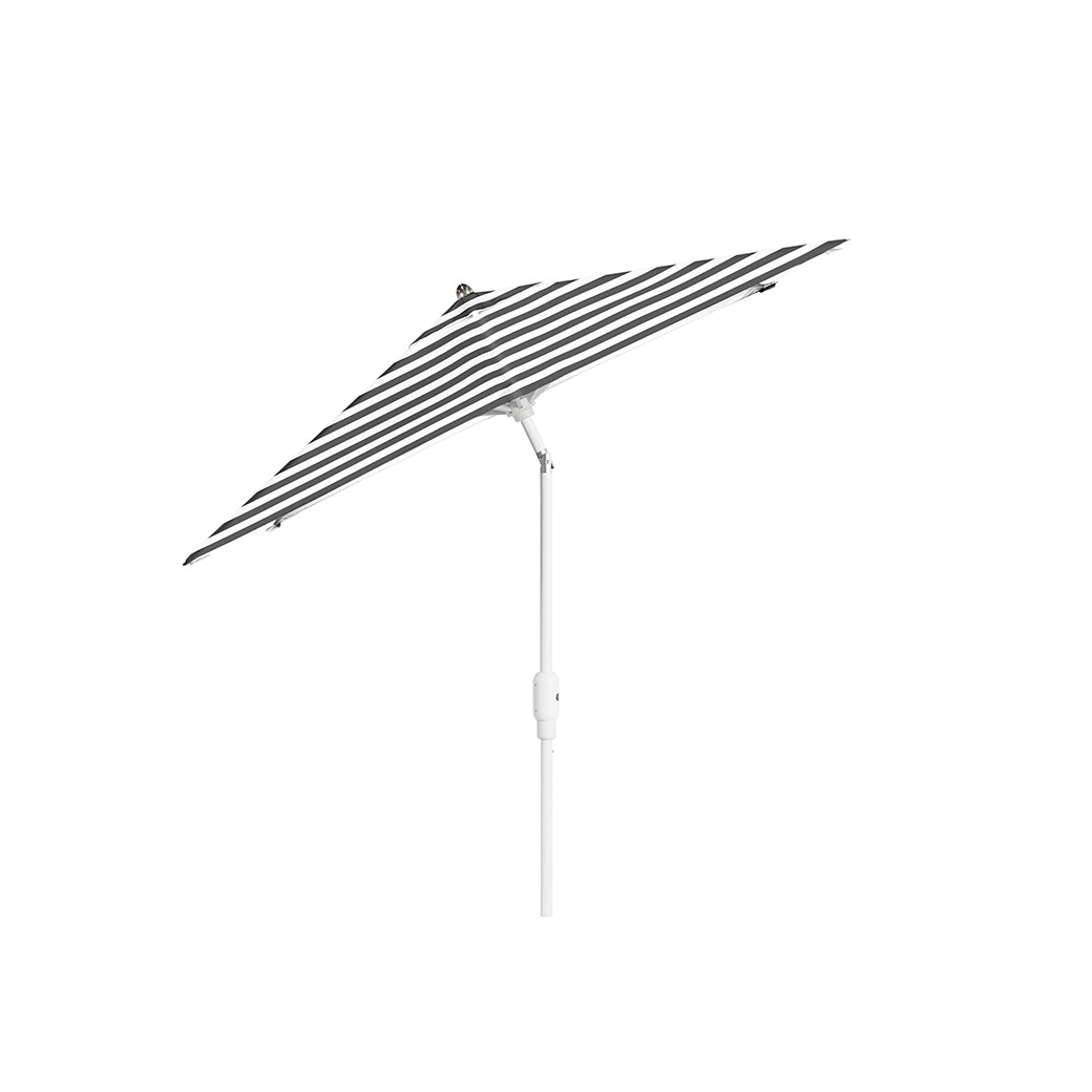 The 6.5 Square Signature 360° Tilt Umbrella by Ledge Lounger, featuring a rustproof frame, elegantly stands with its black and white stripes against a white background.