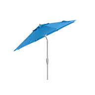 The 7.5 Octagon Signature 360° Tilt Umbrella by Ledge Lounger, featuring a blue canopy with a silver pole, exudes outdoor elegance against the plain white background, showcasing luxury from premium materials.