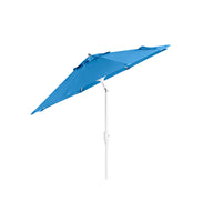 The 7.5 Octagon Signature 360° Tilt Umbrella by Ledge Lounger, crafted in blue with a white pole and crank, stands against a white backdrop. Its open and slightly tilted position exudes outdoor elegance, showcasing its luxurious design.