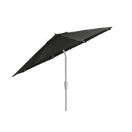 The Ledge Lounger 9 Octagon Signature 360° Tilt Umbrella in black with a silver pole, partially opened against a white background, adds elegance to any outdoor space.