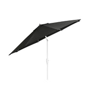 The 9 Octagon Signature 360° Tilt Umbrella by Ledge Lounger exudes luxury with its large, dark green canopy and white pole angled right. Crafted from premium materials, the open umbrella highlights its fabric and spokes against a plain white background, perfect for elegant outdoor spaces.