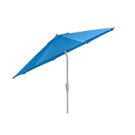 The 9 Octagon Signature 360° Tilt Umbrella by Ledge Lounger features a sleek, modern blue design with a luxury silver pole and tilting mechanism, perfect for enhancing any outdoor space. It is presented open against a plain white background.