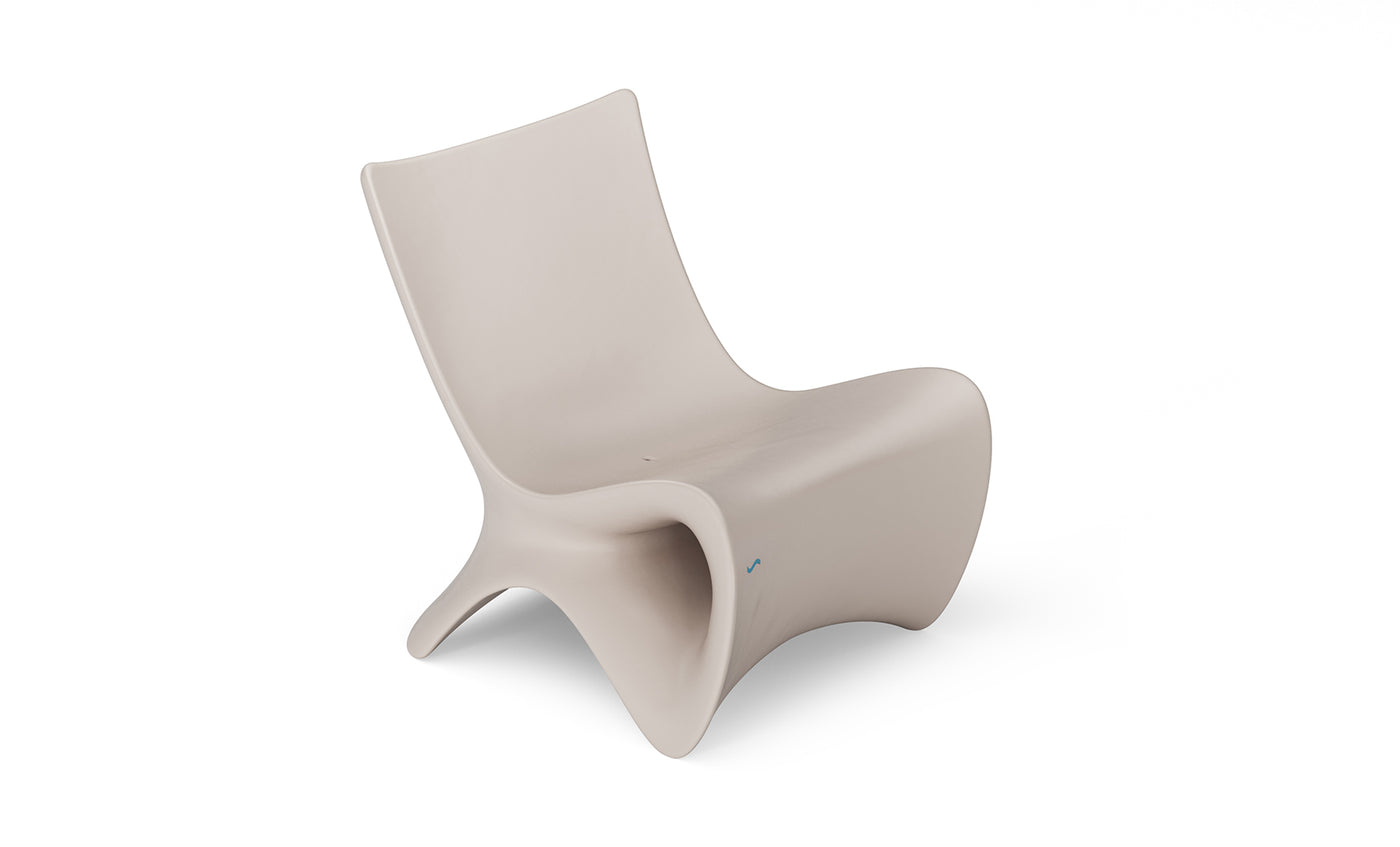 The Autograph Chair by Ledge Lounger is a modern beige lounge chair with a sleek, curved design ideal for outdoor relaxation. Its minimalist, fluid look features smooth contours and a low seat, offering elevated ergonomics for ultimate comfort.