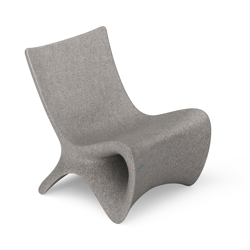 The Autograph Chair by Ledge Lounger epitomizes elevated ergonomics with its sleek gray design, curved lines, and armless frame, creating a streamlined look. Perfect for any space, it stands elegantly on a white background offering both comfort and style.