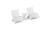 Two Classic Luxury In-Pool Chair Duo pieces by Ledge Lounger, with a small matching side table on a white background, showcase sleek, minimalist design and gentle curves—ideal for contemporary spaces.