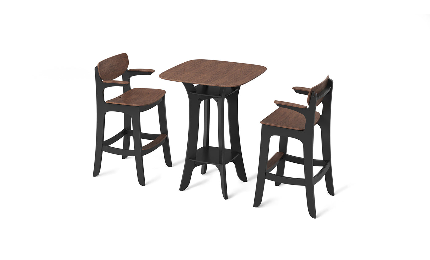 The Haven Hightop Set by Ledge Lounger includes a wooden high-top table with black legs and footrest, paired with two matching bar stools featuring minimalist curved backrests, all set against a crisp white background.
