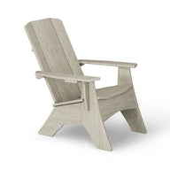 A light gray Mainstay Ultimate Adirondack chair by Ledge Lounger with wide armrests and a slanted back, shown angled on a white background—ideal as a stylish outdoor lounge chair.