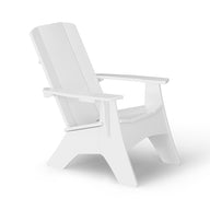 A white Adirondack chair is shown at an angle against a plain white background. The chair has a slatted backrest and wide armrests, characteristic of its classic design.