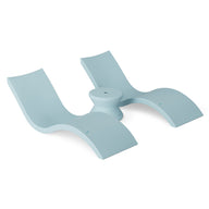 A modern abstract sculpture in light blue, reminiscent of two curved seats like the Signature In-Pool Chaise Loungers from Ledge Lounger, joined by a central circular base with smooth lines, embodies a minimalist design ideal for the Outdoor Oasis In-Pool Furniture Bundle.