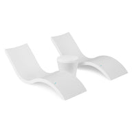 The Ledge Lounger Signature Chaise and Affinity Side Table In-Pool Set features two modern white chaise loungers with curved designs placed side by side, separated by the matching side table, all on a plain white background.