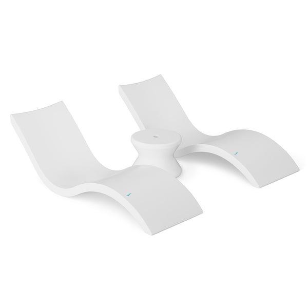 The Outdoor Oasis In-Pool Furniture Bundle by Ledge Lounger features a sleek, modern white plastic lounge chair with a contoured, wave-like design and dual seating areas separated by a circular centerpiece, ideal for any poolside escape on a plain white background.