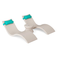 The Ledge Lounger Signature Chaise Headrest Pillow and Side Table In-Pool Set features two modern beige chaises with teal headrests and a matching round side table, all displayed against a white background.