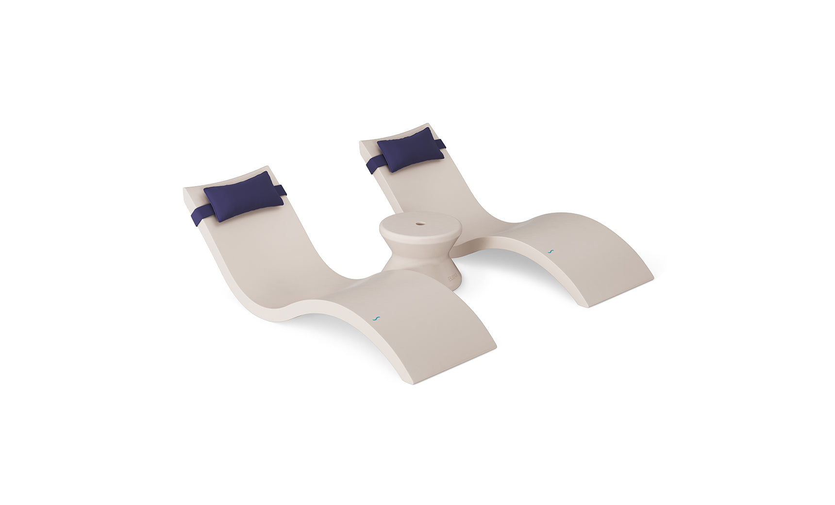 The Ledge Lounger Signature Chaise Headrest Pillow and Side Table In-Pool Set features two modern beige chaises with navy headrests, joined by a round table, all displayed against a white background.